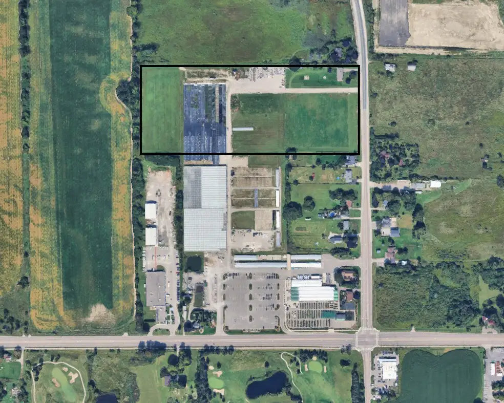 Satellite image of Vandermeer property showing greenhouses, parking lot, and fields, with box highlighting new land purchase.
